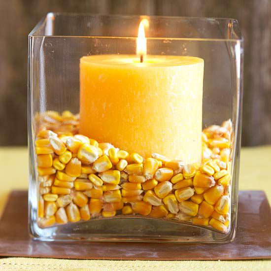 Fall candle with dried corn in clear vase