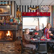 group eating at buckhorn supper club near fireplace