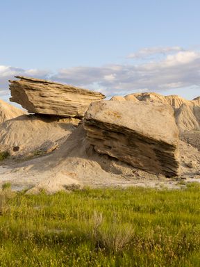 Unusual formations of large, hard rocks balanced on eroding softer material give Toadstool Geologic Park its name.