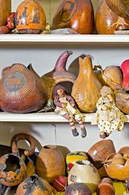 painted gourds on shelf