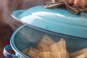 tamales in blue steamer pot